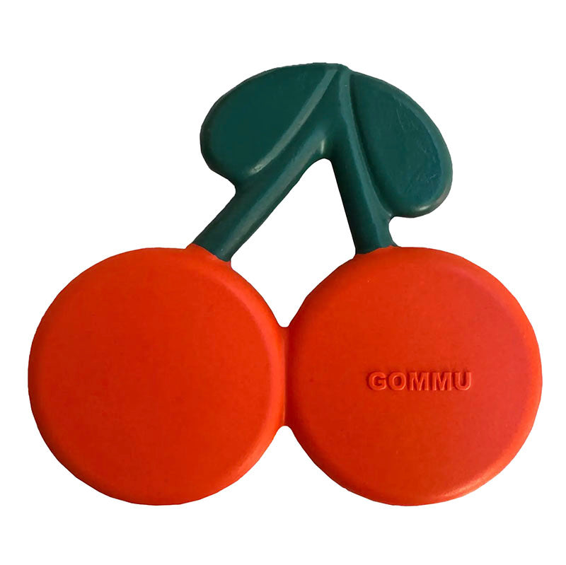 A pair of bright orange cherry-shaped silicone earplugs with dark green stems, featuring the brand name 'GOMMU' embossed on one earpiece