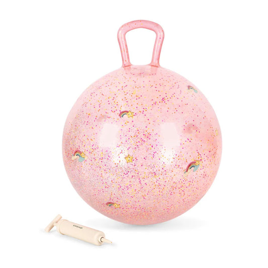 A pink inflatable bounce ball with a handle, filled with glitter and decorated with small rainbow motifs, shown with a small manual pump 