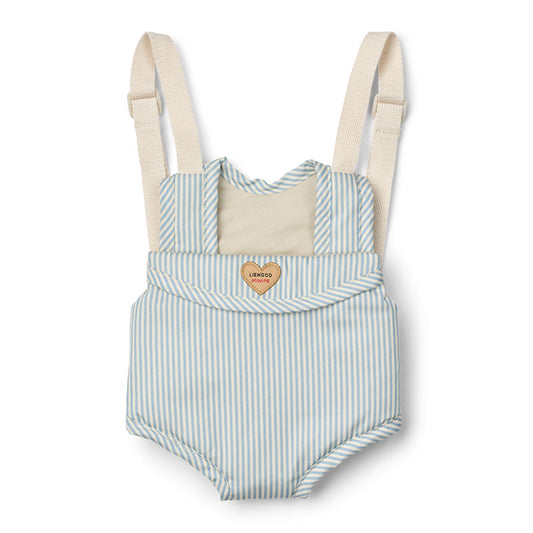 A doll carrier featuring light blue and white vertical stripes, with a cream-coloured panel and adjustable straps. 