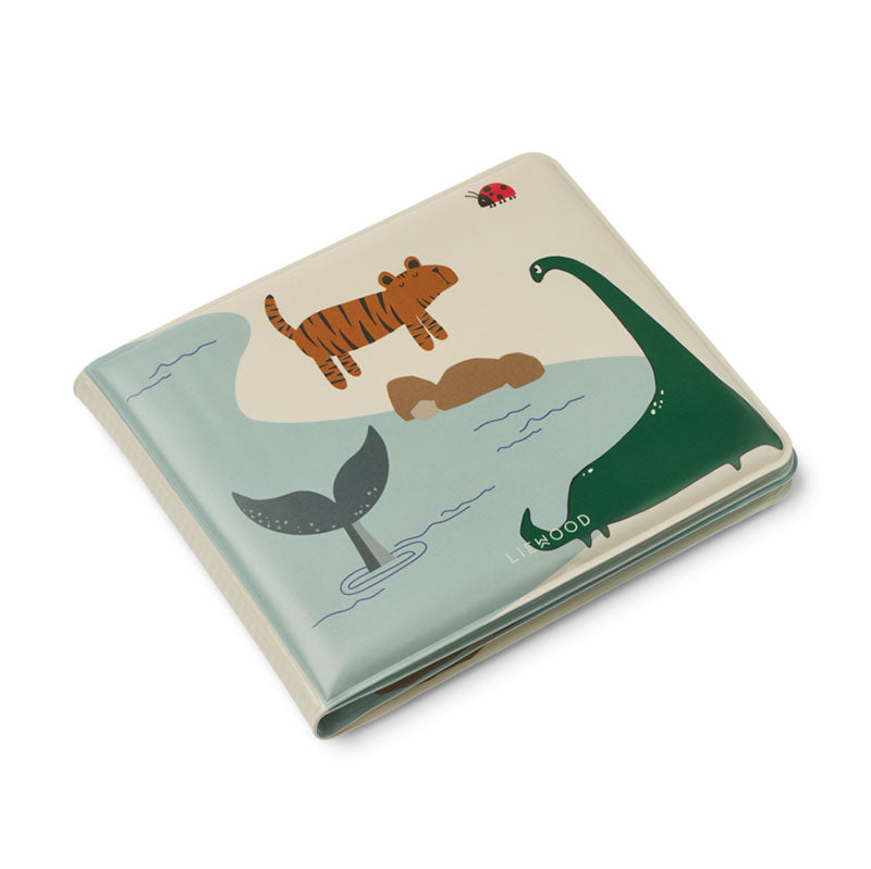 A square children's bath book with a whimsical animal illustration, featuring a tiger, dinosaur, whale tail, and ladybug on a cream and pale blue background.