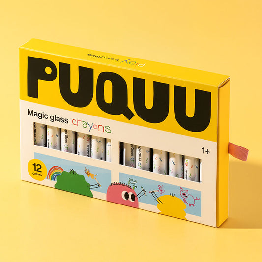 A box of PUQUUU Magic glass crayons for kids, featuring a bright yellow and white packaging with cartoon illustrations and a pull tab