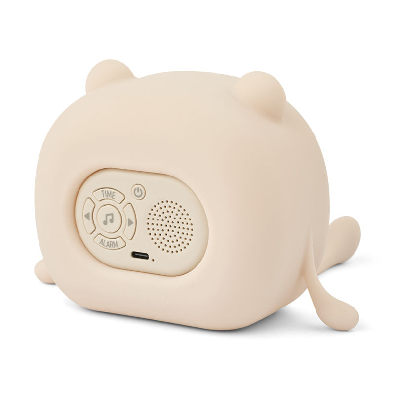 A small beige silicone alarm clock shaped like a cartoon animal, shown from the back 