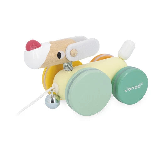 Wooden toy with wheels and a pull string, featuring the brand 'Janod'.