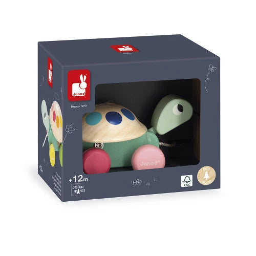 Toy turtle in packaging with Janod logo